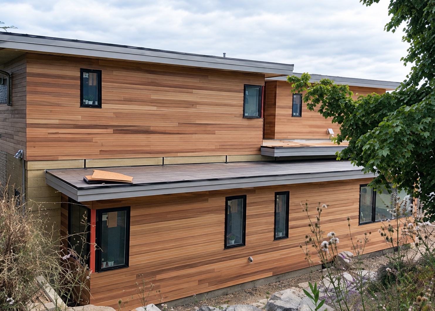 Contemporary residential exterior finished with warm wood-look horizontal siding